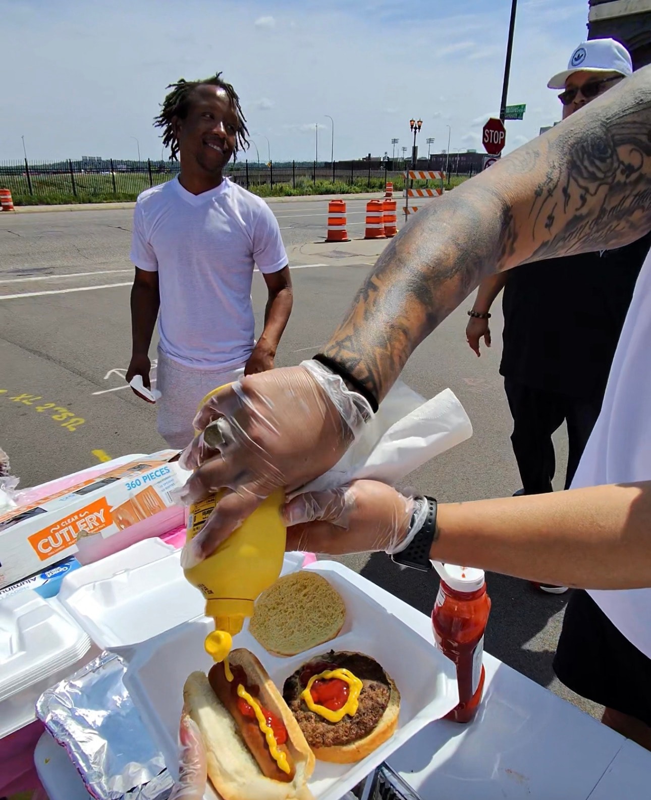 Community members receiving food and supplies at a Threshold to Thrive outreach event
